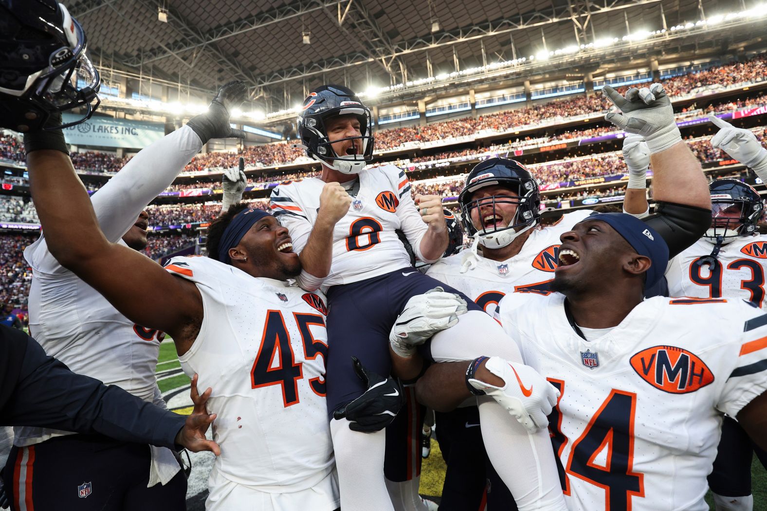 The Chicago Bears’ Cairo Santos is lifted up by his teammates after he kicked a 48-yard field goal to defeat the Minnesota Vikings in an NFL game on Sunday, November 16. The Bears won 19-17.