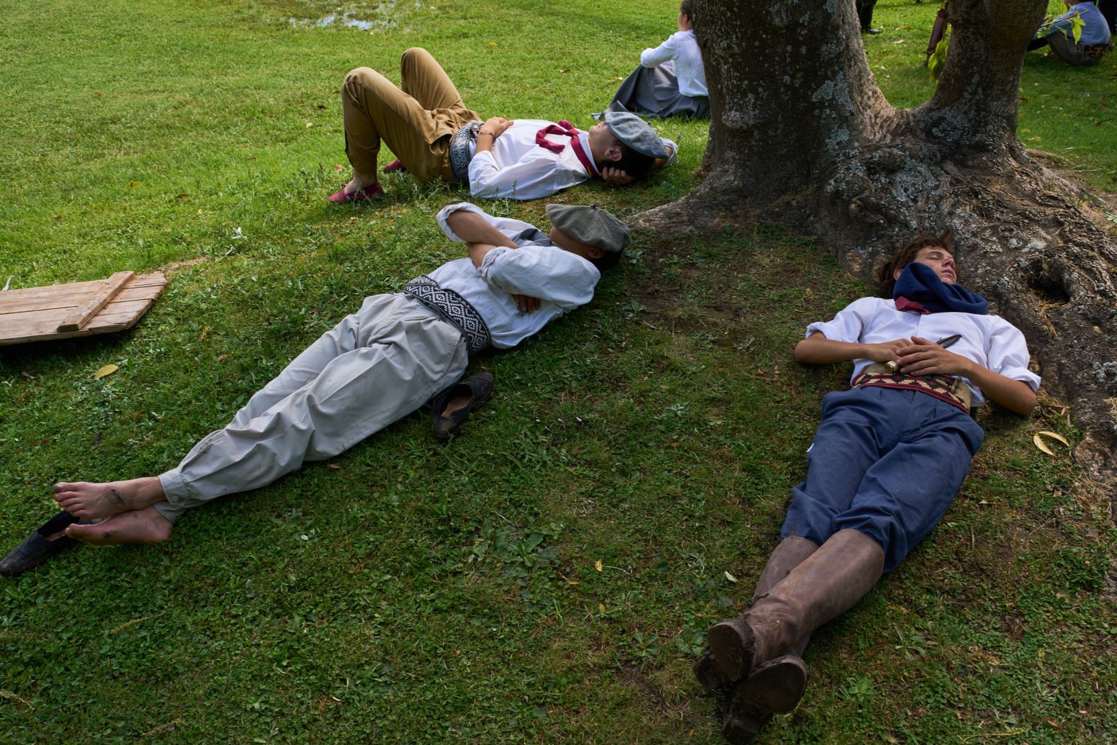Gauchos nap on Tradition Day, an annual holiday to honor gaucho culture, in San Antonio de Areco, Argentina, on Sunday, November 16.