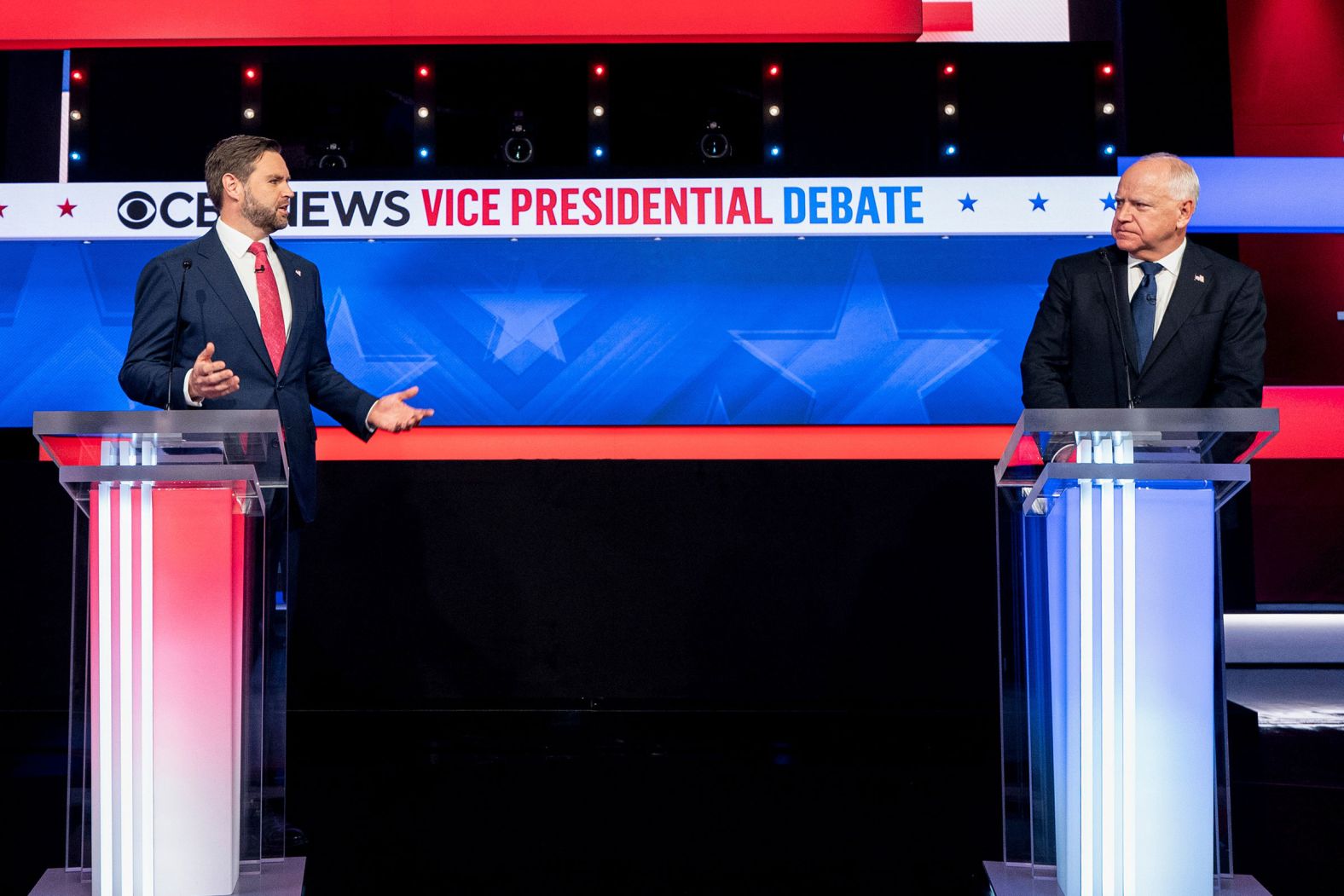 Senator JD Vance, a Republican from Ohio and Republican vice-presidential nominee, left, and Tim Walz, governor of Minnesota and Democratic vice-presidential nominee, during the first vice presidential debate at the CBS Broadcast Center in New York, US, on Tuesday, Oct. 1, 2024. 