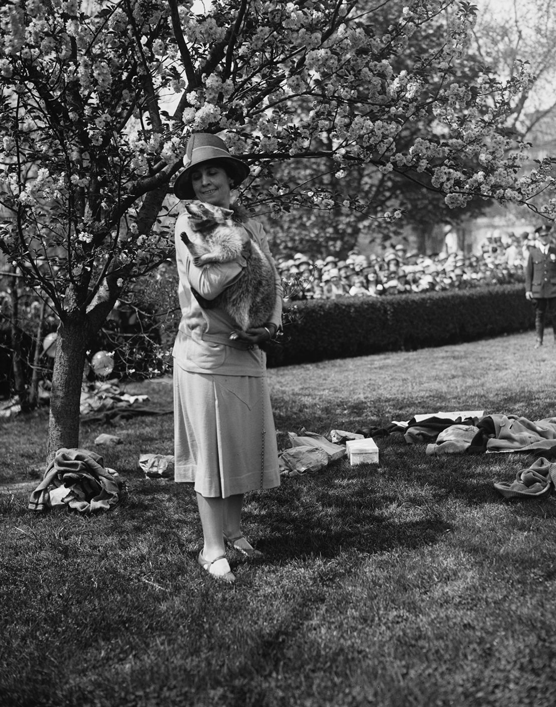 First Lady Grace Coolidge with her pet raccoon, Rebecca, during the annual Easter Egg Roll in 1927.