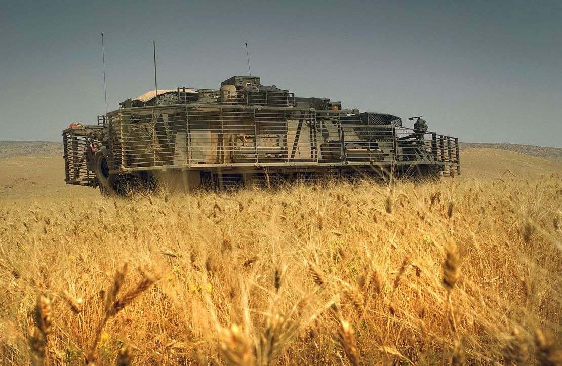 A US Army Stryker Infantry Carrier Vehicle is parked in a field to assist in a joint US and Iraqi Army search operation for hidden weapon caches in Sinjar, Ninawa Province, Iraq.