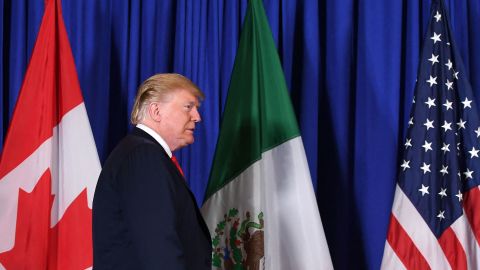 In this November 2018 photo, then-President Donald Trump arrives to deliver a statement along with Mexican President Enrique Pena Nieto and Canadian Prime Minister Justin Trudeau, on the signing of a new free trade agreement in Buenos Aires, Argentina.