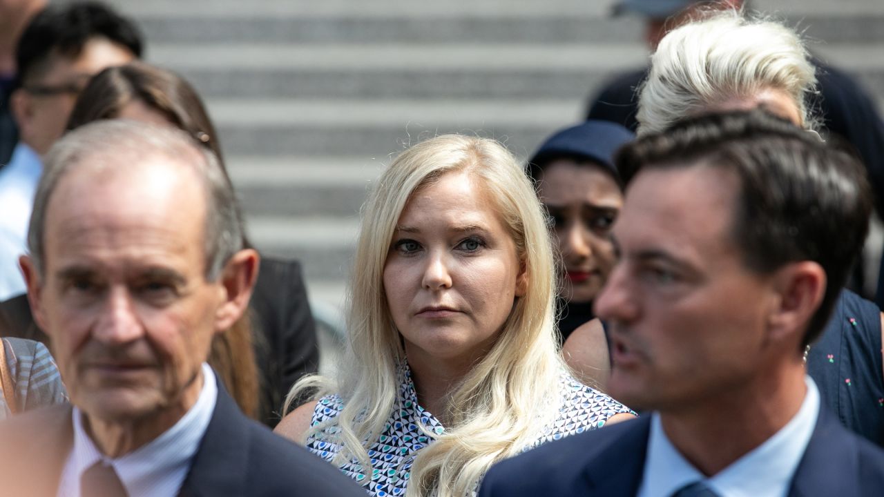Virginia Giuffre, an alleged victim of Jeffrey Epstein, center, exits from federal court in New York, U.S., on Tuesday, Aug. 27, 2019.