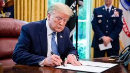 In this May 2020 photo, then-President Donald Trump signs a proclamation in the Oval Office of the White House in Washington, DC.