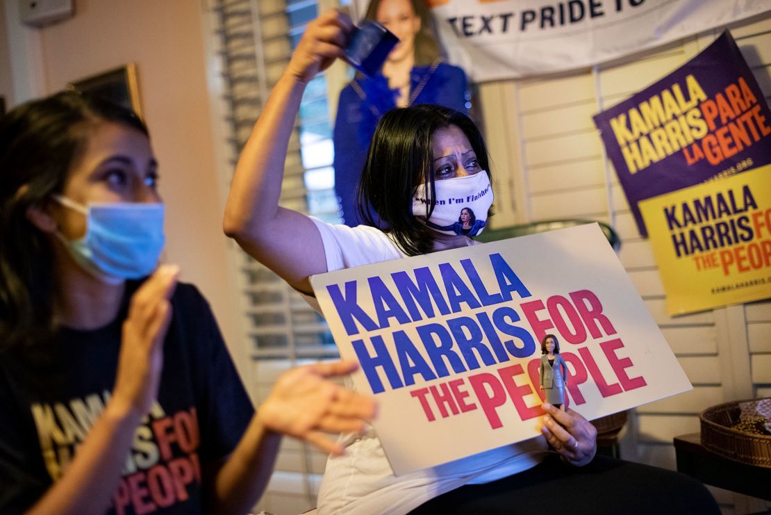 This August 2020 photo shows, Harini Krishnan, then the co-California State Director of South Asians for Biden and a former campaign delegate for Democratic vice presidential nominee Sen. Kamala Harris, and her daughter Janani Krishnan-Jha as they watch the proceedings of the third day of the virtual Democratic National Convention at her home in Hillsborough, California.