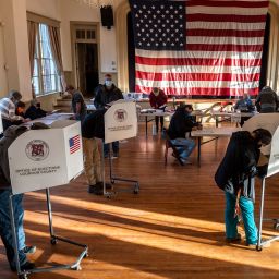 Voters cast their ballots at the old Stone School, used as a polling station, on election day in Hillsboro, Virginia on November 3, 2020.