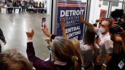 Supporters of President Donald Trump bang on the glass and chant slogans outside the room where absentee ballots for the 2020 general election are being counted at TCF Center on November 4, 2020 in Detroit.