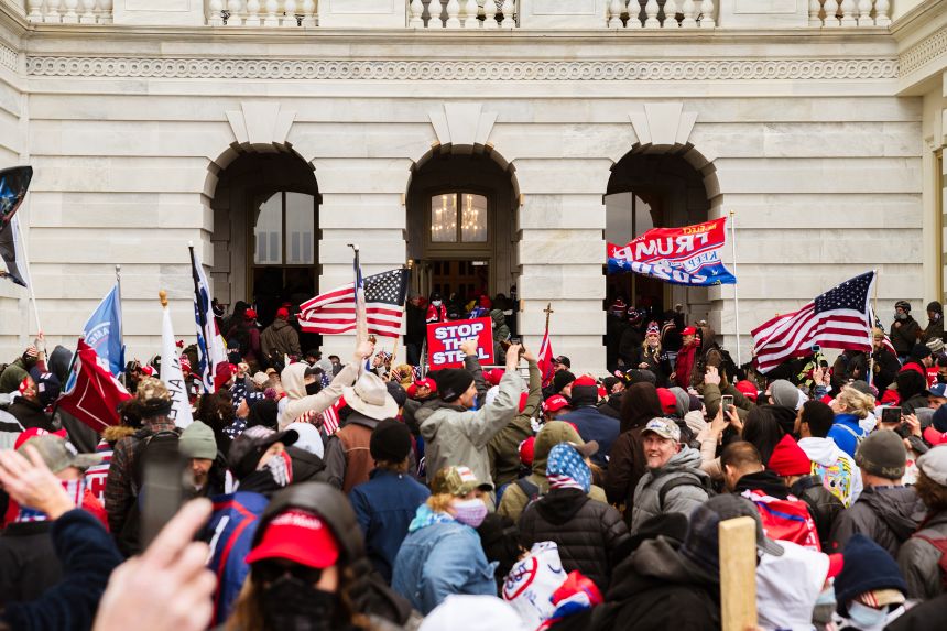 A pro-Trump mob floods into the Capitol Building after breaking into it on January 6, 2021 in Washington, DC.