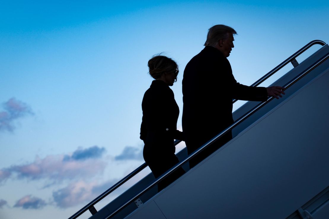 In this January 20, 2021, photo, then-President Donald Trump and first lady Melania Trump board Air Force One at Joint Base Andrews in Maryland.