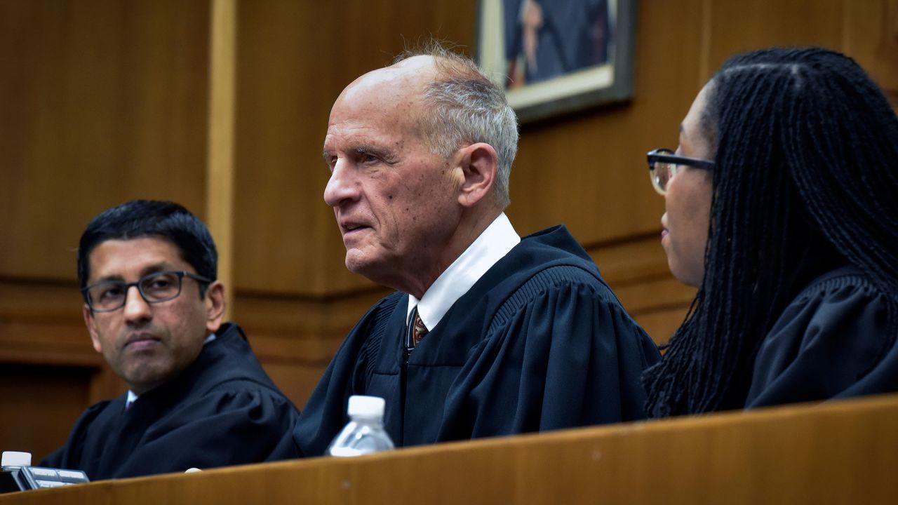 In this December 2019 photo, Judge David Tatel, center, listens to arguments as local high school students observe a reenactment of a landmark Supreme court case at the US Court of Appeals in Washington, DC.