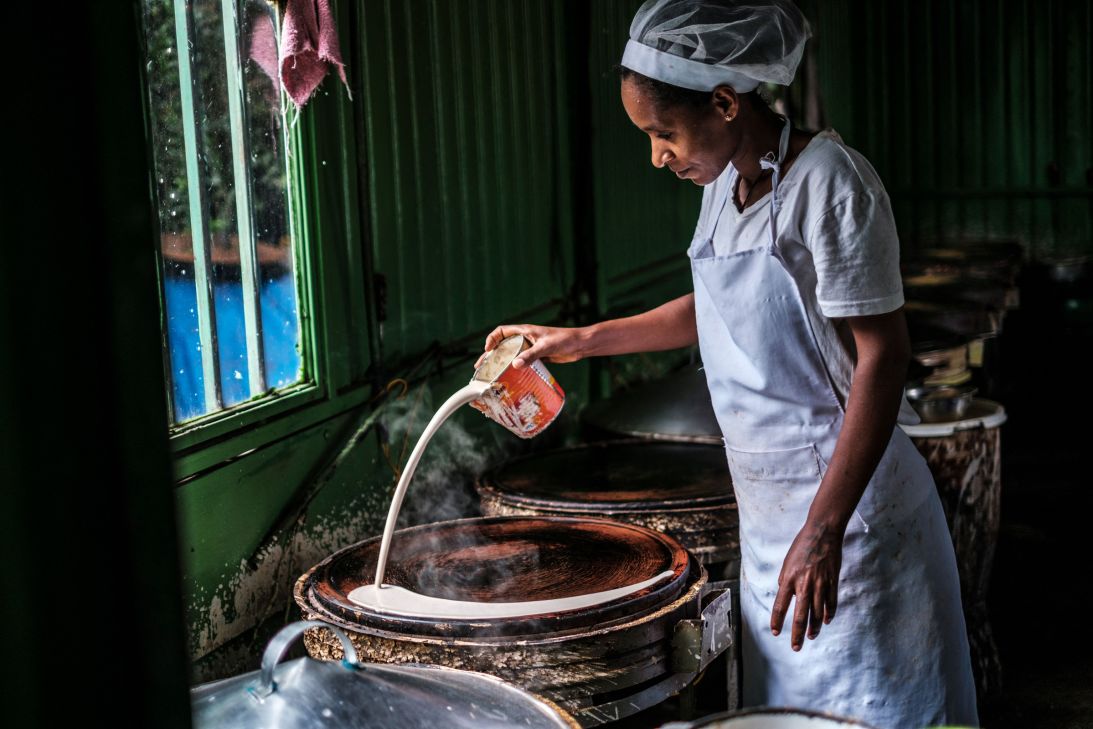 A woman prepares injera, a sour fermented flatbread made with teff flour, the staple grain in Ethiopia.