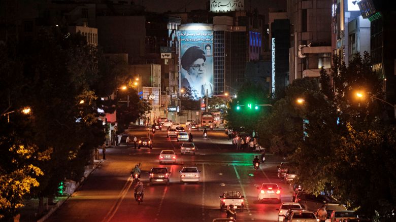A banner depicting Irans Supreme Leader Ayatollah Ali Khamenei is illuminated in downtown Tehran on June 20, 2021.