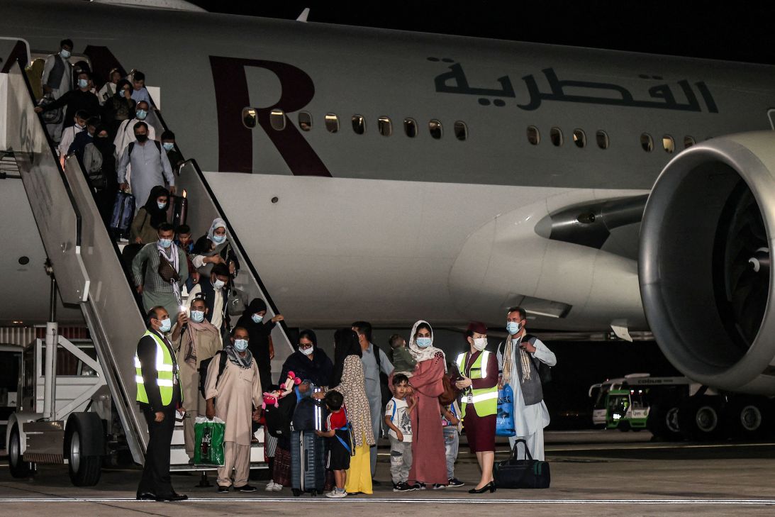Evacuees from Afghanistan, including US citizens, arrive at Hamad International Airport in Qatar's capital Doha on the first flight carrying foreigners out of the Afghan capital since the conclusion of the US withdrawal last month, September 9, 2021.