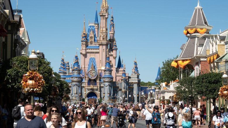 Visitors walk along Main Street at The Magic Kingdom in Walt Disney World on September 30, 2022 in Orlando, Florida.