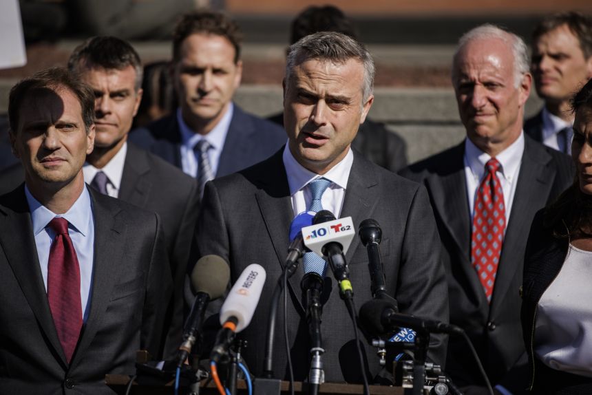 John Poulos, center, then the CEO of Dominion Voting Systems, speaks during a news conference in Wilmington, Delaware, after securing a $787 million settlement with Fox News on April 18, 2023.