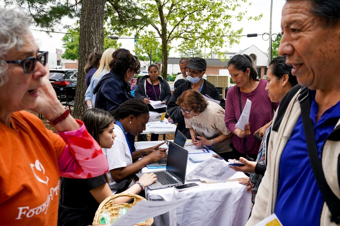 People learn about health resources, including Medicaid eligibility and enrollment information, outside the Springfield/Franconia Family Resources Center on April 27, 2023, in Springfield, Virginia.