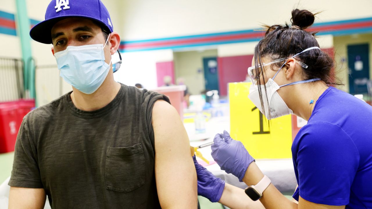 In this 2022 photo, Licensed Vocational Nurse Yustina Mikhael, right, administers a dose of the Jynneos mpox vaccine to a person at an Los Angeles County vaccination site.