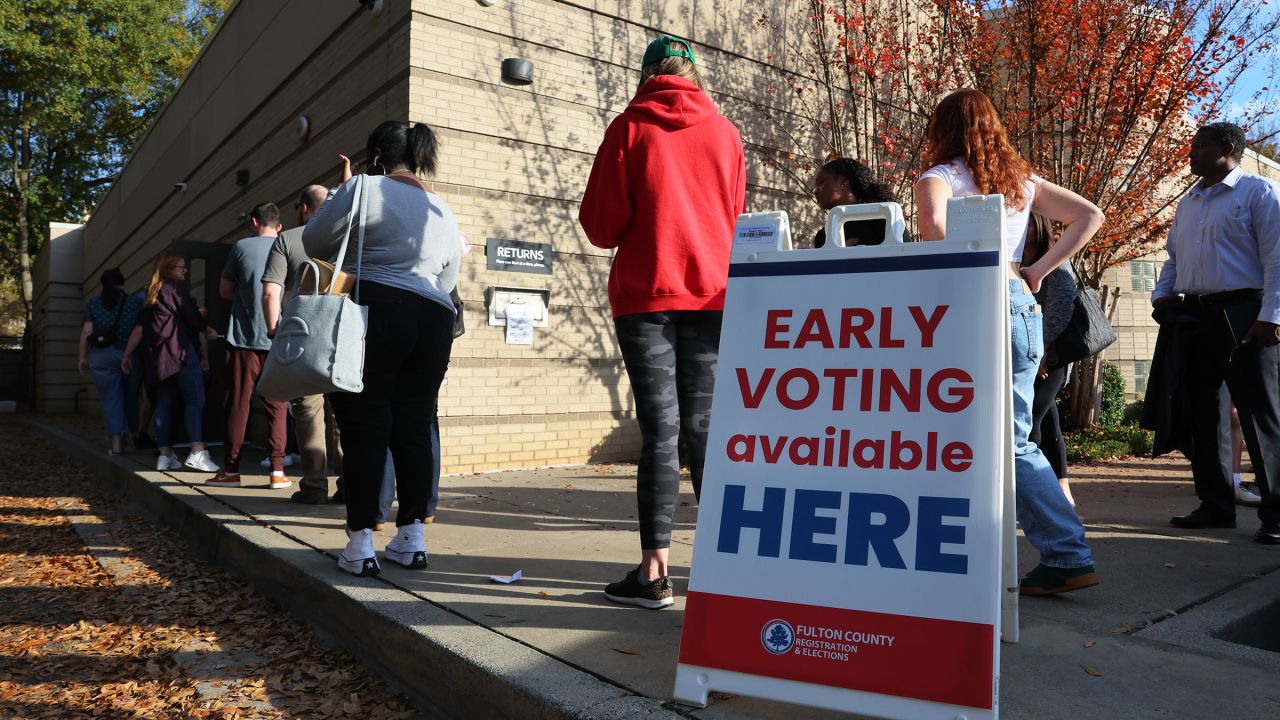 In this November 2022 photo, people wait in line for early voting for the midterm elections at Ponce De Leon Library in Atlanta.