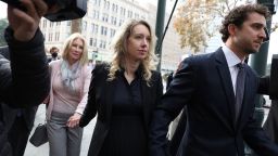 In this November 2022 photo, former Theranos CEO Elizabeth Holmes, center, arrives at court in San Jose, California. 