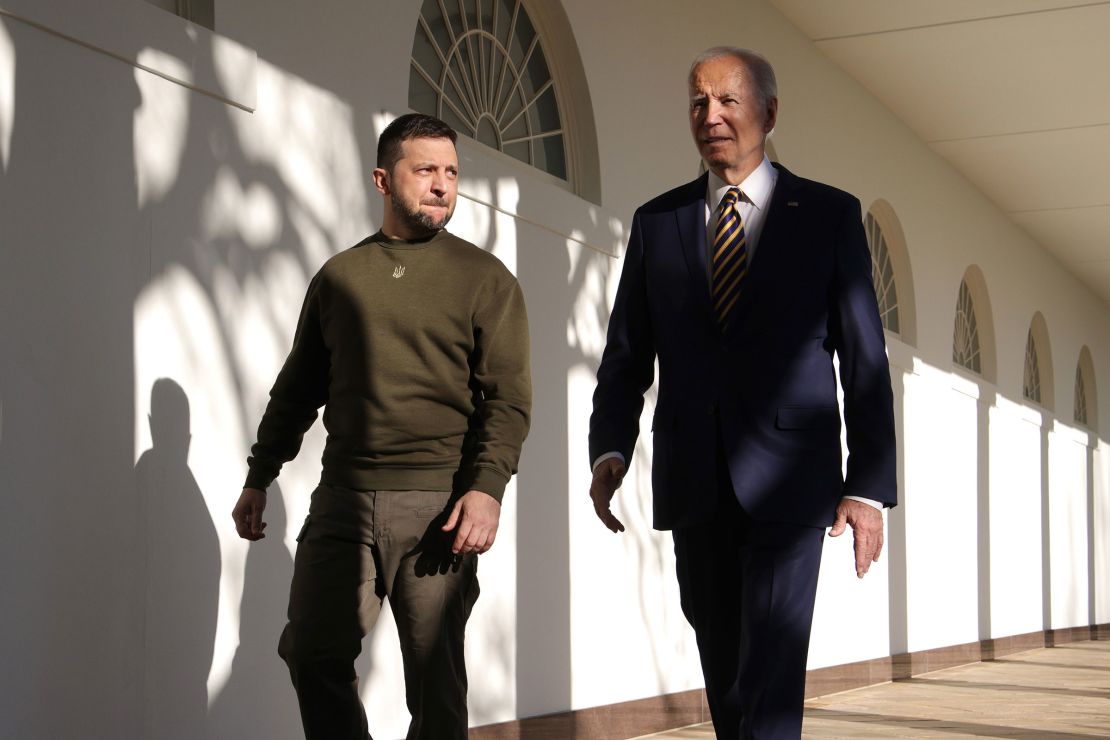 President Joe Biden, right, and Ukraine President Volodymyr Zelensky walk down the Colonnade as they make their way to the Oval Office at the White House on December 21, 2022 in Washington, DC. 