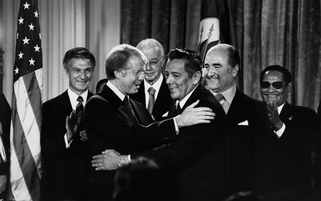 President Jimmy Carter and Panamanian leader General Omar Torrijos embrace each other after signing the Panama Canal Treaty in Washington, DC, on September 7, 1977.