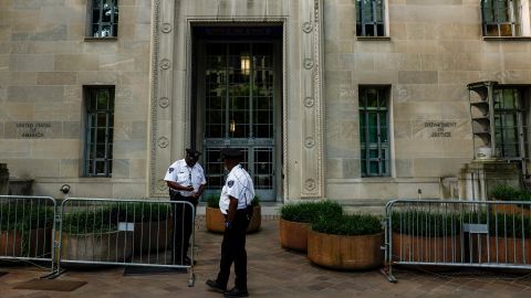Police officers stand in front of the Department of Justice on June 9, 2023 in Washington, DC.