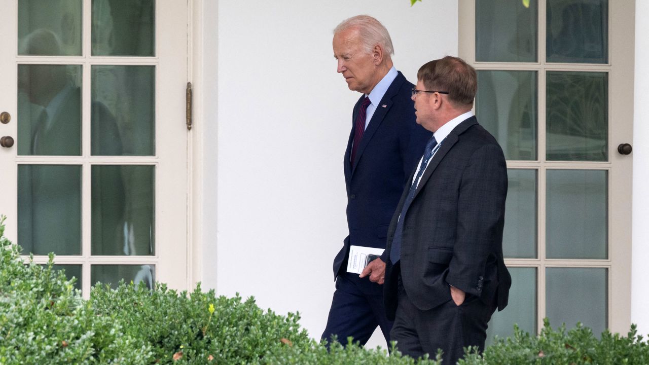 President Joe Biden speaks with White House Physician Kevin O'Connor as he arrives back at the White House in Washington, DC, on August 28, 2023, following a visit to Eliot-Hine Middle School.
