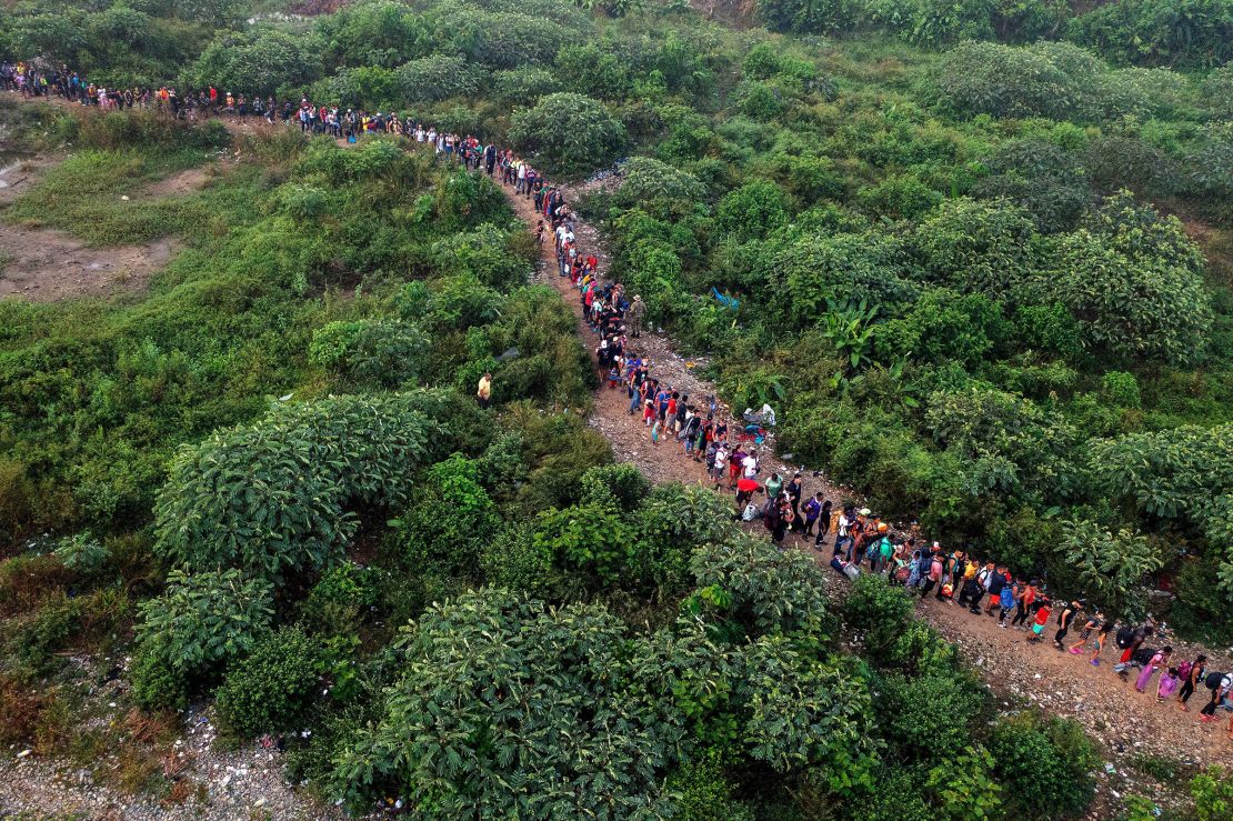 Migrants walking by the jungle near Bajo Chiquito village, the first border control of the Darien Province in Panama, on September 22, 2023.