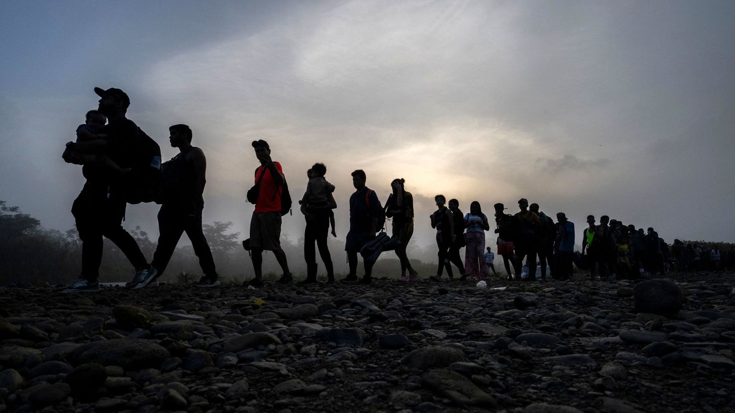 Migrants walk by the jungle near Bajo Chiquito village, the first border control of the Darien Province in Panama, on September 22, 2023. 