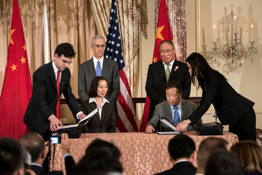 Then-US Special Envoy for Climate Change Todd Stern (standing on the left) and China National Development and Reform Commission Vice Chairman Xie Zhenhua (standing on the right) during an eco-partnership event at the US state department in Washington, DC, in 2013.