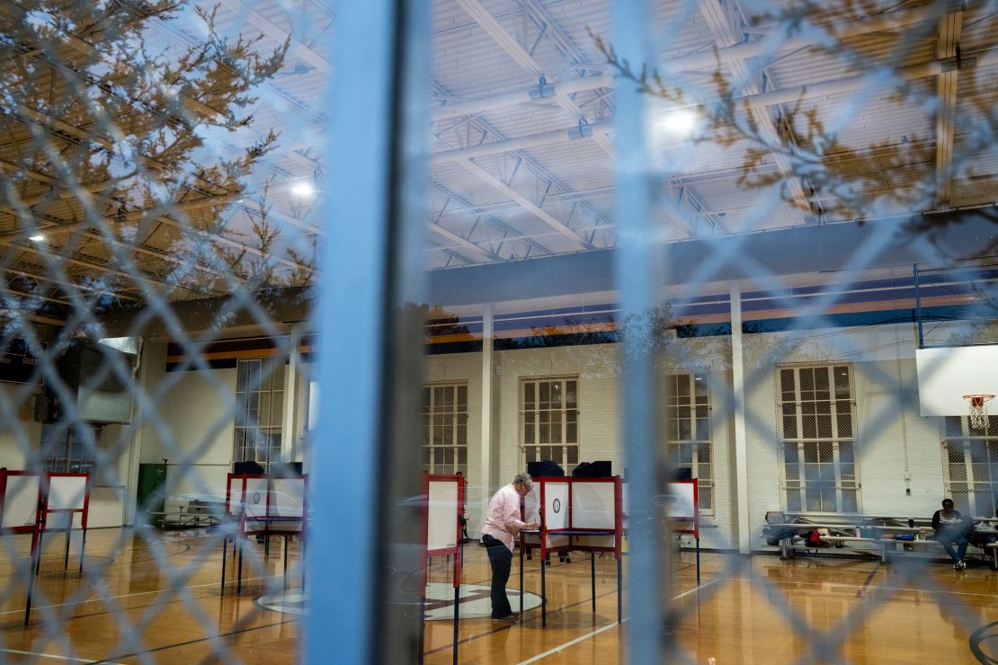 Voters attend to cast their ballots at the Highland Middle School on November 7, 2023 in Louisville, Kentucky.