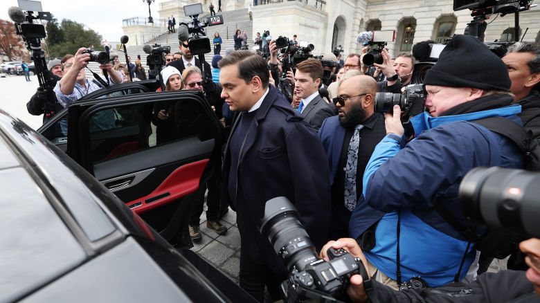 Rep. George Santos is surrounded by journalists as he leaves the US Capitol after his fellow members of Congress voted to expel him from the House of Representatives on December 1, 2023 in Washington, DC.