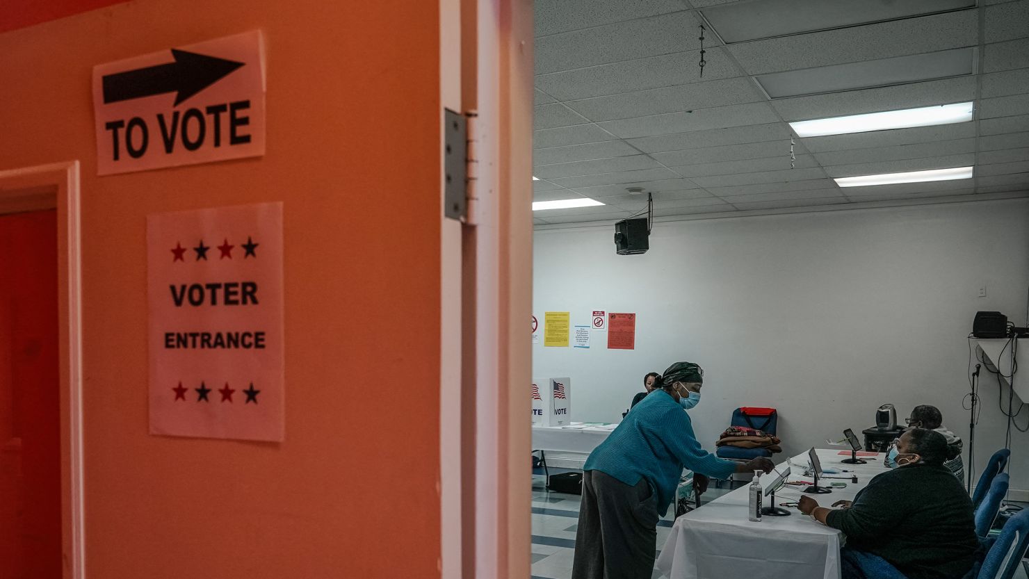 A voter checks in before casting a primary ballot at a polling place in Atlanta, Georgia, on March 12.