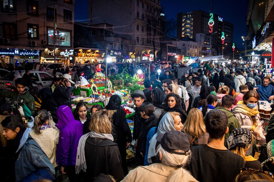 People shop at a market, as they prepare for Nowruz, the Persian New Year, in Tehran, Iran on March 12, 2024.