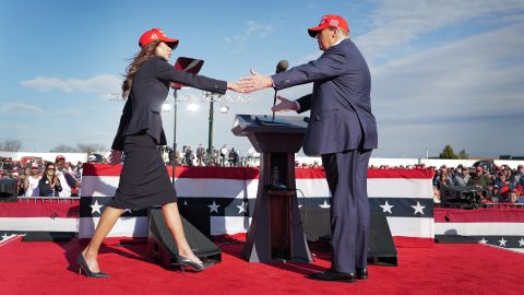 Republican presidential candidate former President Donald Trump greets South Dakota Gov. Kristi Noem during a rally at the Dayton International Airport on March 16 in Vandalia, Ohio. 
