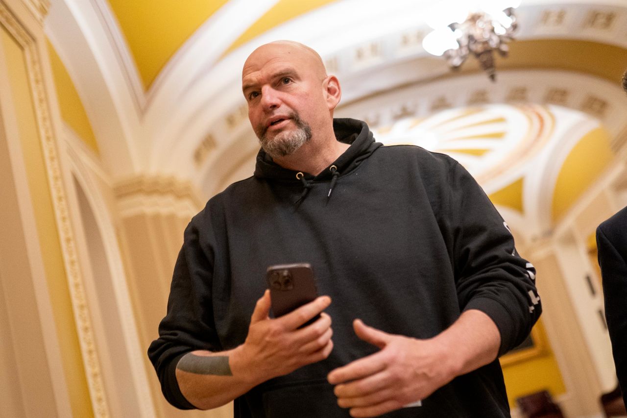 Sen. John Fetterman walks toward the Senate Chambers on March 23, in Washington, DC. 