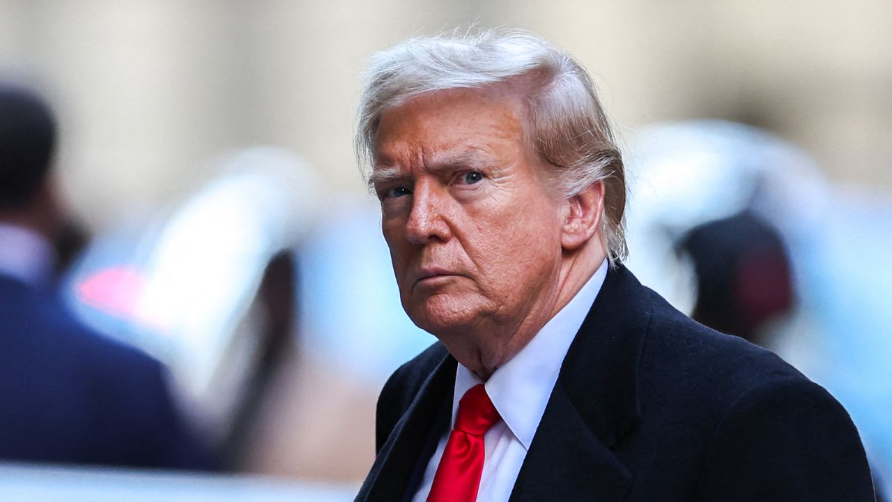 Former President Donald Trump arrives at 40 Wall Street after his court hearing to determine the date of his trial for allegedly covering up hush money payments linked to extramarital affairs in New York City on March 25. 