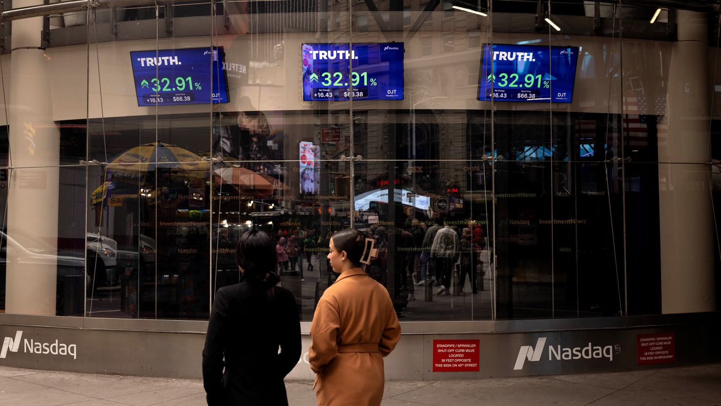 Screens displaying Truth Social stock information outside the Nasdaq MarketSite in New York on March 26.