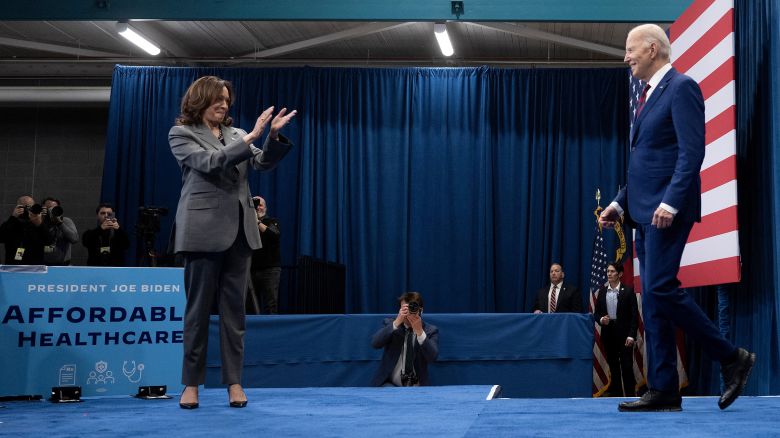 Vice President Kamala Harris claps as President Joe Biden arrives to speak about healthcare during an event at the John Chavis recreation center on March 26, in Raleigh, North Carolina. 