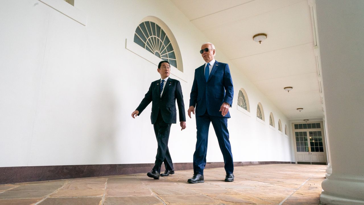 President Joe Biden and Japanese Prime Minister Fumio Kishida walk on the colonnade as they make their way to a meeting in the Oval Office at the White House on April 10 in Washington, DC.
