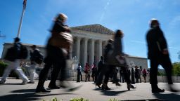 People walk outside of the Supreme Court on April 16, in Washington, DC.