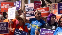 Members of Arizona for Abortion Access, the ballot initiative to enshrine abortion rights in the Arizona State Constitution, hold a press conference and protest condemning Arizona House Republicans and the 1864 abortion ban during a recess from a legislative session at the Arizona House of Representatives on April 17 in Phoenix.