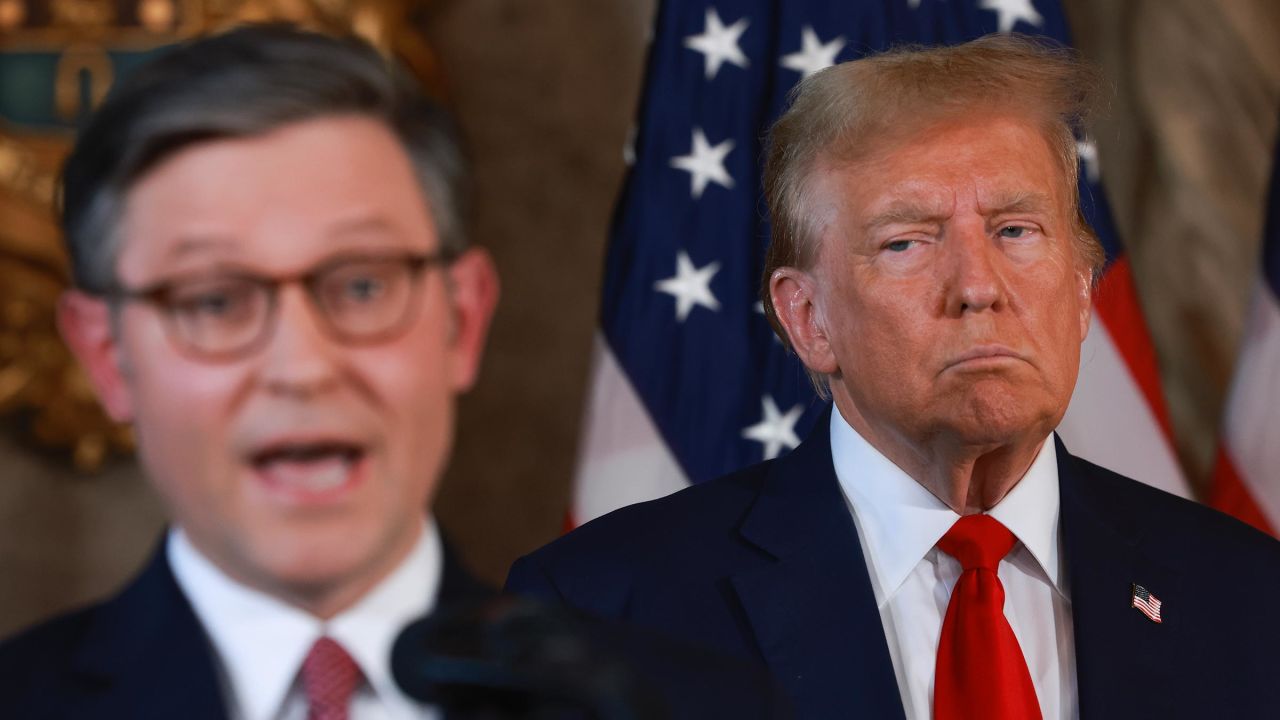 In this April 12 photo, Donald Trump listens as House Speaker Mike Johnson speaks during a press conference at Mar-a-Lago in Palm Beach, Florida. 