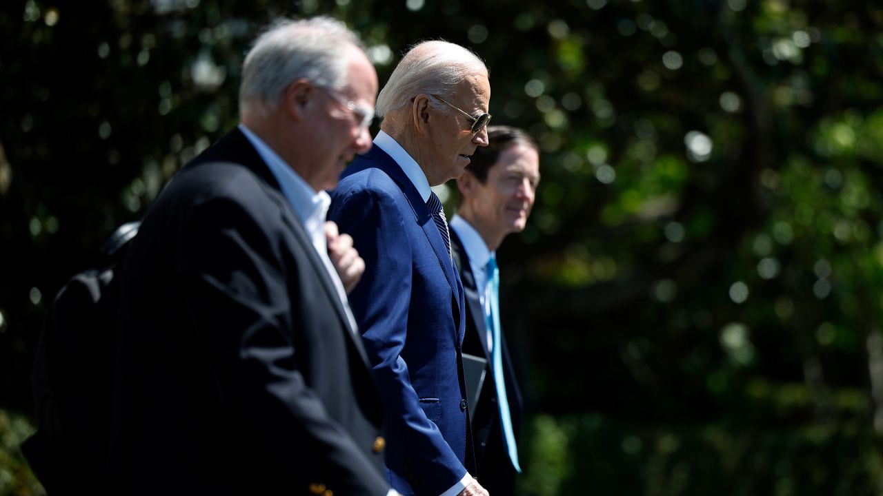 In this April 2024 photo, President Joe Biden is accompanied by senior advisor Mike Donilon, left, and and Deputy Chief of Staff Bruce Reed, right, as they depart the White House in Washington, DC.