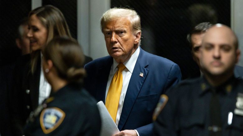 Former US President Donald Trump leaves the courtroom at the end of the day's proceedings in his criminal trial for allegedly covering up hush money payments at Manhattan Criminal Court on May 14, 2024 in New York City.
