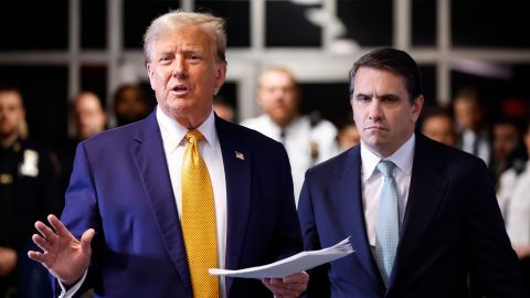 Former President Donald Trump speaks to members of the media alongside his lawyer Todd Blanche at his trial for allegedly covering up hush money payments at Manhattan Criminal Court on May 14. 
