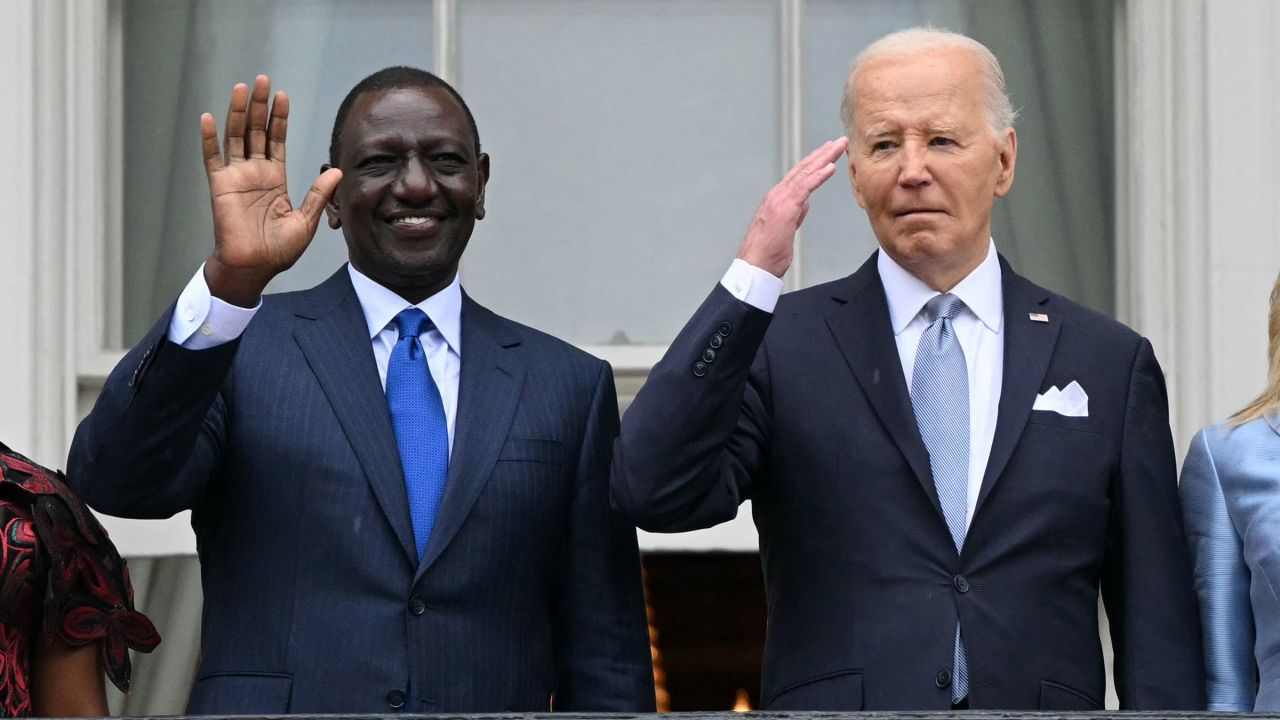 Kenyan President William Ruto and US President Joe Biden acknowledge the crowd during an official arrival ceremony on the South Lawn of the White House in Washington, DC, on May 23, 2024. 