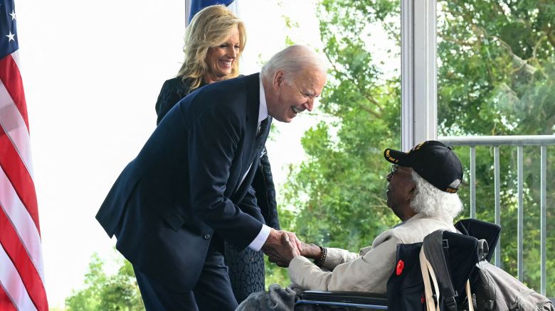 US President Joe Biden and US First Lady Jill Biden speak with a US WWII veteran during the US ceremony marking the 80th anniversary of the World War II "D-Day" Allied landings in Normandy, at the Normandy American Cemetery and Memorial in Colleville-sur-Mer, which overlooks Omaha Beach in northwestern France, on June 6, 2024.