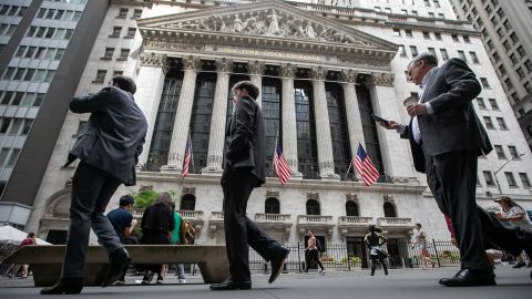Pedestrians in front of the New York Stock Exchange (NYSE) in New York, on Friday, June 7.