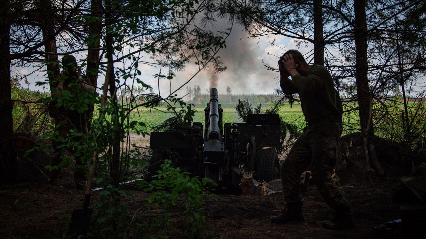 Ukrainian soldiers with the 57th Motorized Brigade operate at an artillery position on June 9, near Vovchansk in the Kharkiv Region of Ukraine.